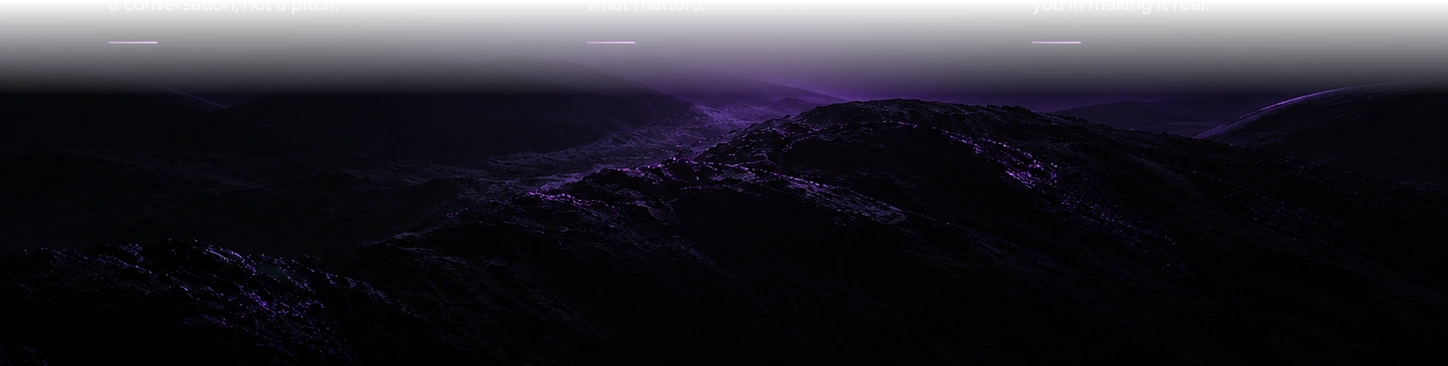Plum-lit mountain peaks beneath a dark sky